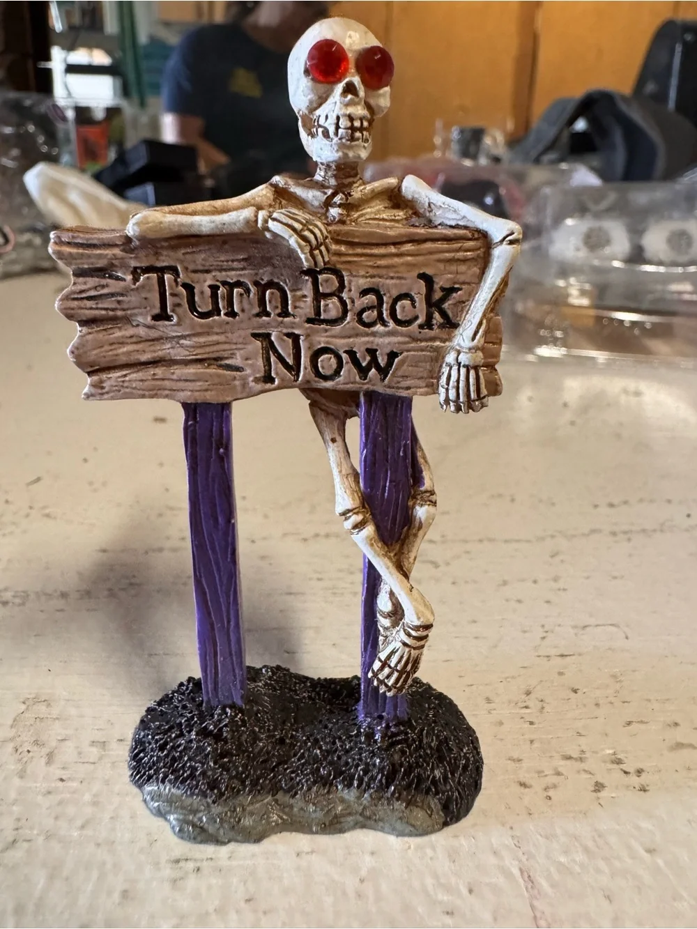 Lemax Skeleton 'Turn Back Now' Sign with Red Eyes and Purple Posts